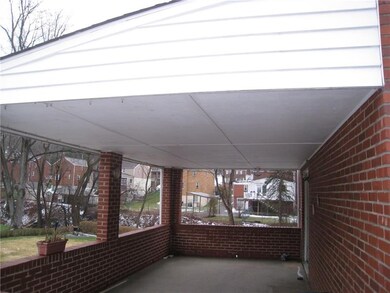The covered side porch is directly off of the kitc