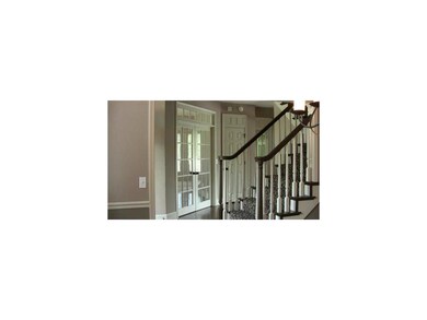 Front entrance staircase leading to the upstairs. 