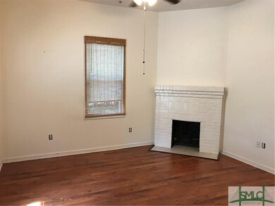 Unit A Living Room with decorative Fireplace, hard