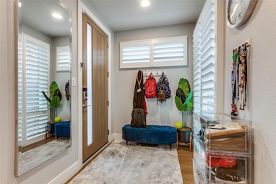Mudroom with wood-type flooring