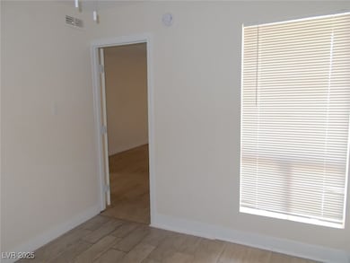 Unfurnished room featuring light wood-style floori