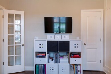 Main level flex room with plenty of natural lighti
