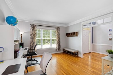Living room view to the foyer and front entry door