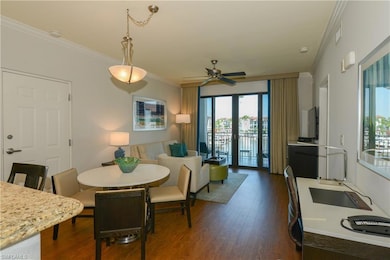 Dining area with ornamental molding, dark wood-sty