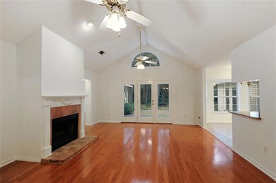 Comfortable living room with vaulted ceiling and f