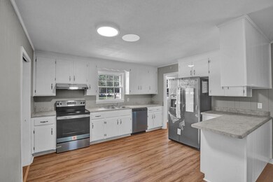 kitchen w new ss appliances and counter tops