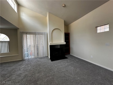 Unfurnished living room with carpet flooring, a fi