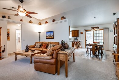 Vaulted ceiling, ceiling fan, pot shelving, & plan