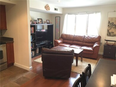 Kitchen to the left and living room with window on