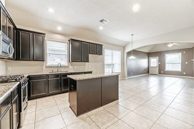 The kitchen is equipped with an amazing amount of cabinetry and countertops. This island is not only beautiful but it is functional as well, providing storage below and a great workspace above. All of the drawers and cabinets are functional.