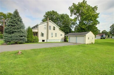 Right side of house and 2 car garage