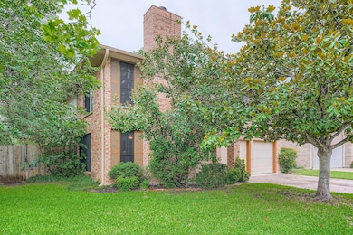 View of front of property with brick siding, conc