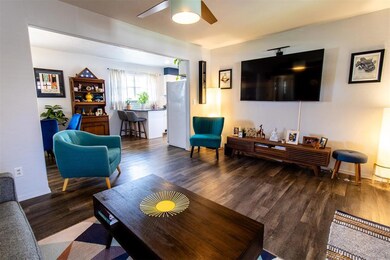 Living room with hardwood / wood-style floors and 