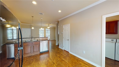 Kitchen with stainless steel dishwasher, washer an