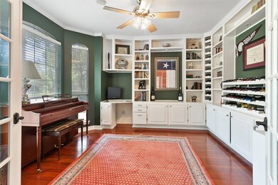 Imagine working from home in this amazing private study with French doors, wood floors, bay window and built-in cabinets.