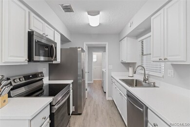 Updated Galley Kitchen w/ Corian Countertops & New