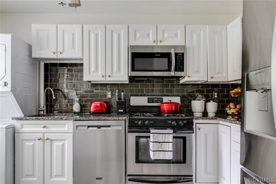 Stainless appliances, white cabinets