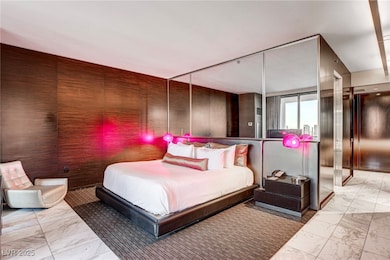 Bedroom with marble look tile flooring