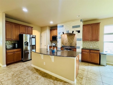 Kitchen featuring a sink, appliances with stainle