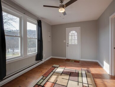 The living room of this home contains hardwood flo