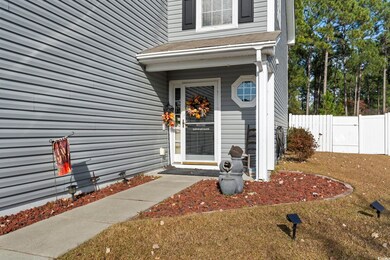 Entrance to property featuring a lawn