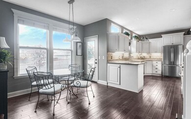 Crisp bright kitchen with loads of cabinetry. Hand