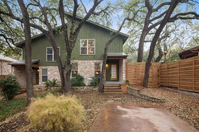 View of front of property with stone siding, meta
