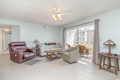 Living room featuring light tile patterned floors,
