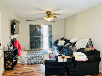 Living room with balcony access.