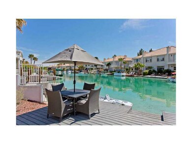 Property Photo. Lake view with patio set and boot