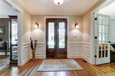 Foyer has antiqued lighting to match the elegant d