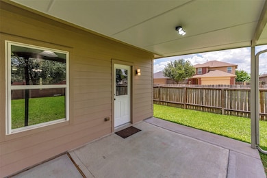 Added covered back patio provides a comfortable ou