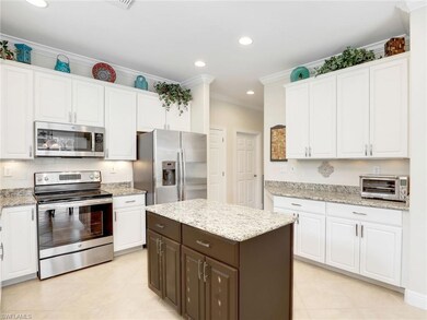 12839 Carrington Cir unit 102, Naples, FL 34105 - photo 2