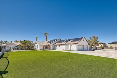 View of front facade with driveway, a front yard,