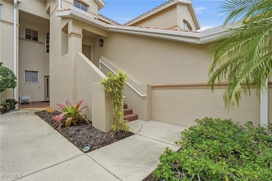 Doorway to property with stucco siding and a tile roof