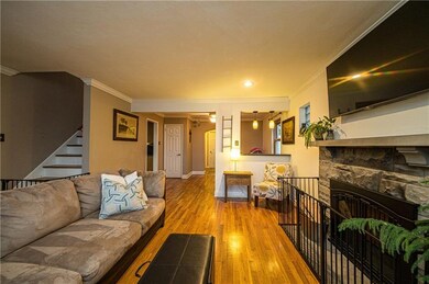 Living room open to adjacent to den/playroom.