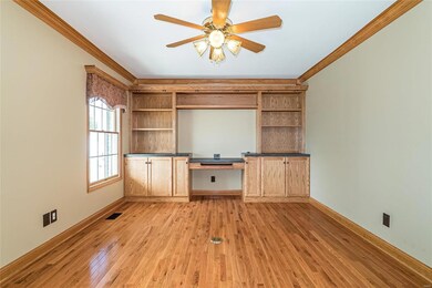 Private office with custom built-ins and glass Fre