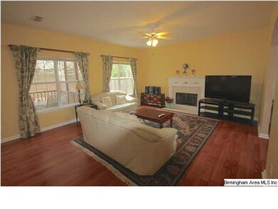 Family room w/ gas fireplace and lots of natural l