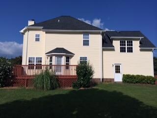 This golf course like yard is fenced in and you will love sitting on the deck in the mornings