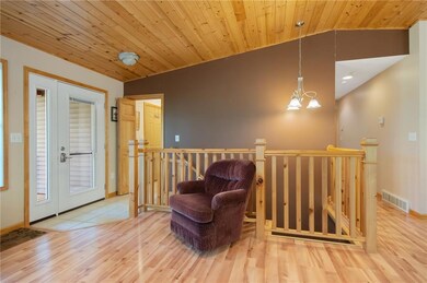 Gorgeous wood floors & ceiling greet you.