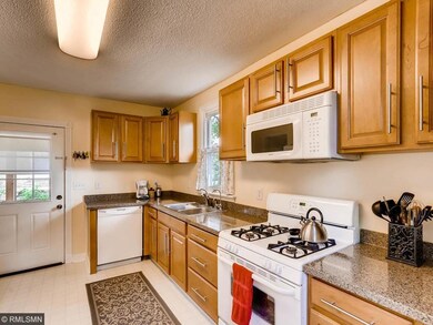 The updated kitchen features newer cabinets, count