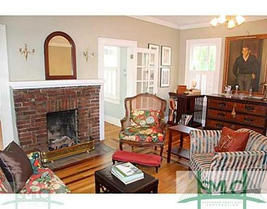 Living Room. French doors flanking the fireplace l