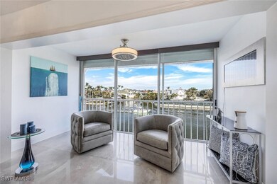 Sitting room with expansive windows, plenty of natural light, and baseboards