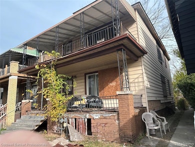 View of front of property with a balcony