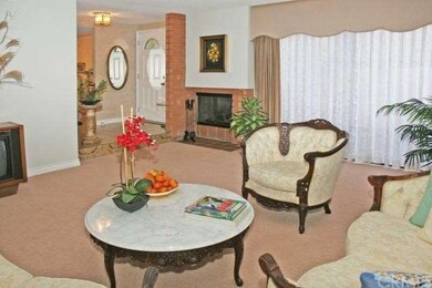 Formal living room has gas fireplace and big slide
