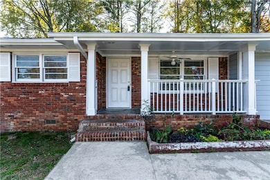 Property entrance featuring covered porch