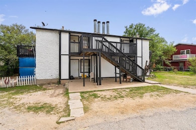 Rear view of property featuring a patio area, fen