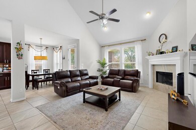 Living area with high vaulted ceiling, ceiling fa