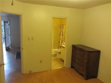 Unfurnished bedroom with light wood-style flooring