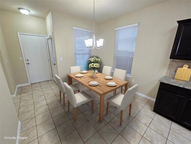 Dining room featuring light tile patterned floori